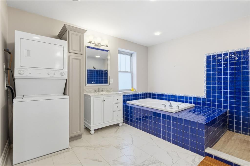1311 Breed Street Pittsburgh, PA 15203 - Photo 23 of 44 a bathroom with a tub and a sink