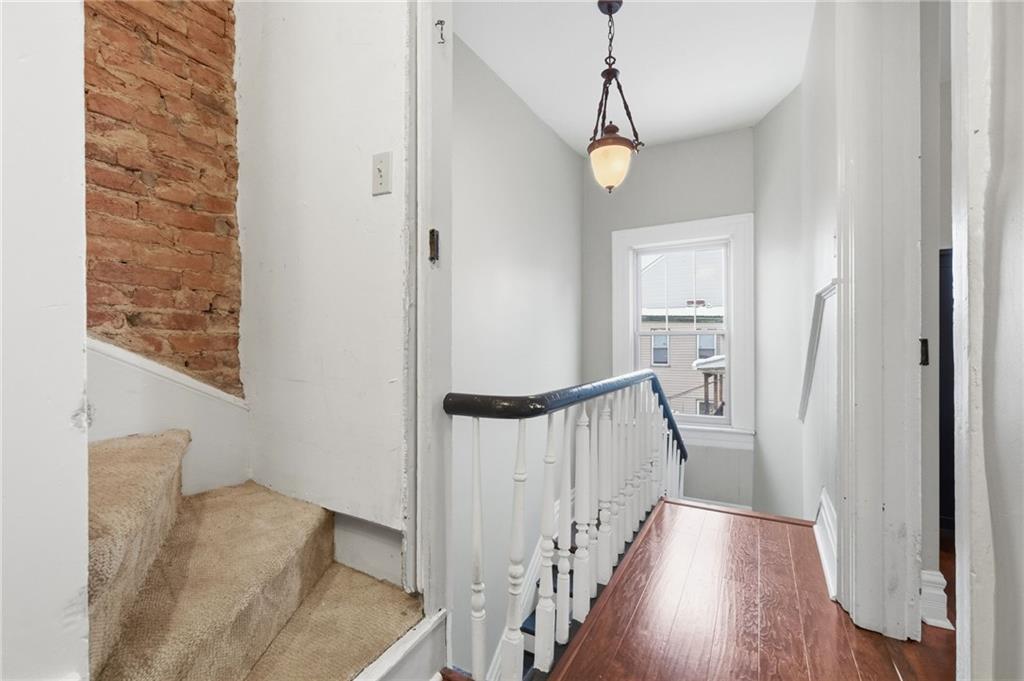 1311 Breed Street Pittsburgh, PA 15203 - Photo 25 of 44 a view of a hallway with wooden floor and staircase