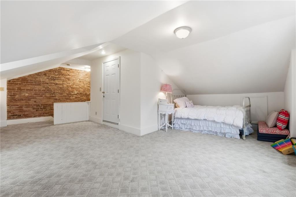 1311 Breed Street Pittsburgh, PA 15203 - Photo 29 of 44 a bedroom with a bed and a window