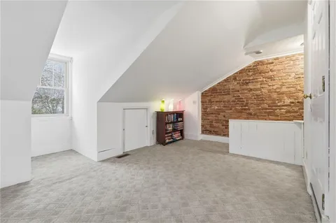 a picture of a room with a floor and white kitchen