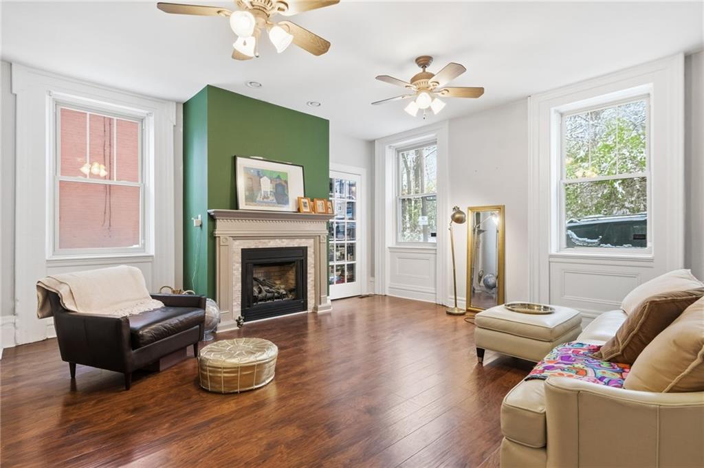 1311 Breed Street Pittsburgh, PA 15203 - Photo 5 of 44 a living room with furniture a fireplace and a large window