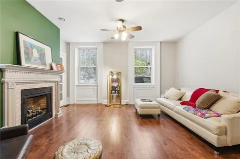 a living room with furniture and a fireplace