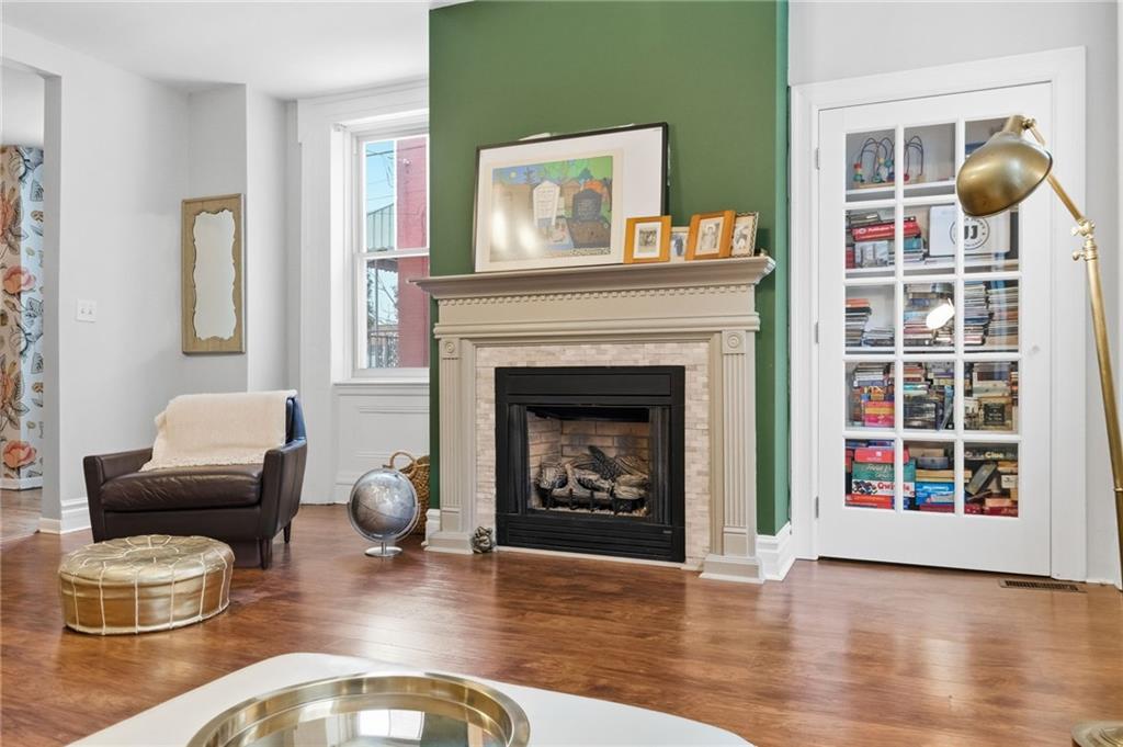 1311 Breed Street Pittsburgh, PA 15203 - Photo 9 of 44 a living room with furniture and a fireplace