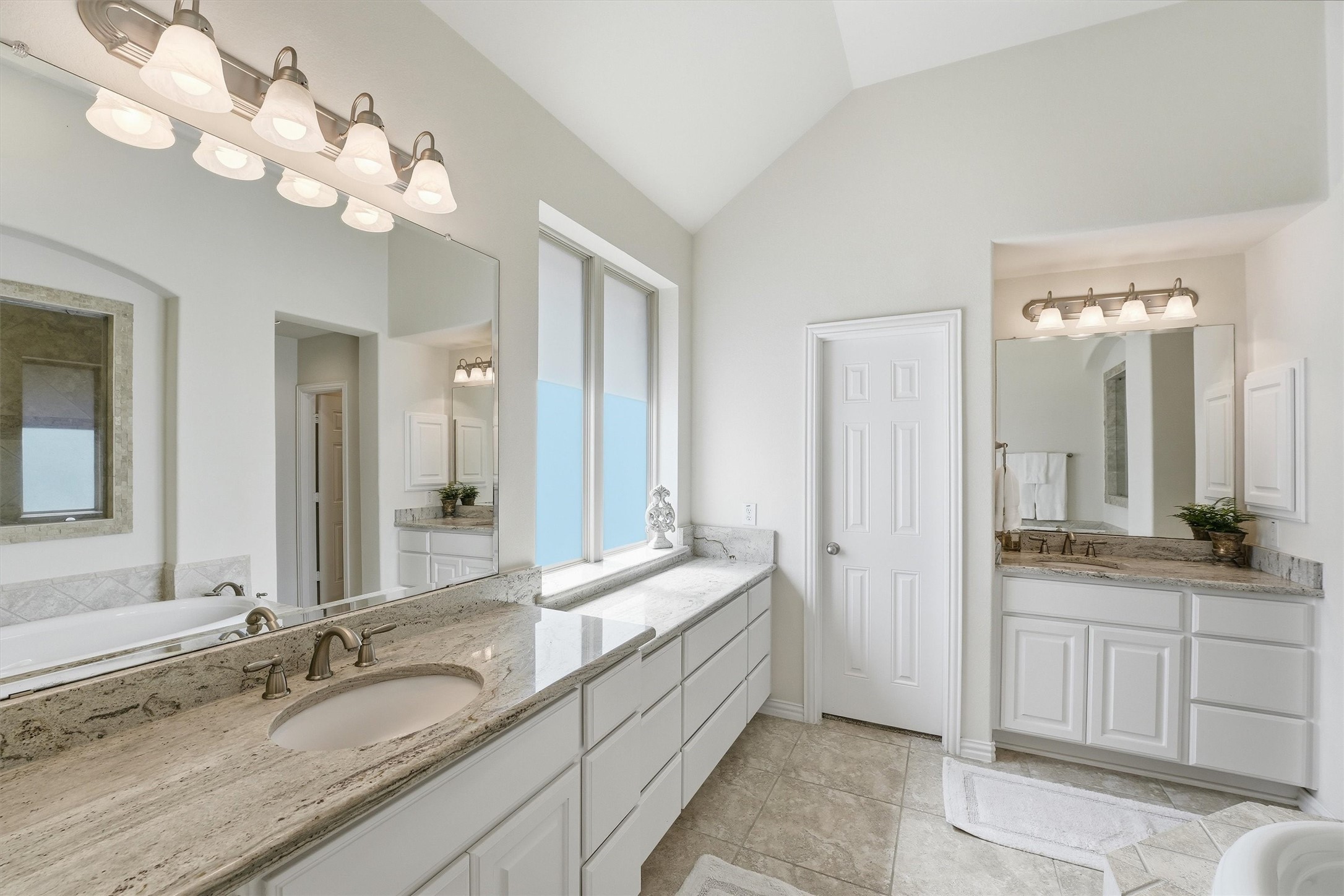 27118 Cross Pointe Court Fulshear, TX 77441 - Photo 19 of 40 Primary bathroom with doors to access large closet with custom storage
