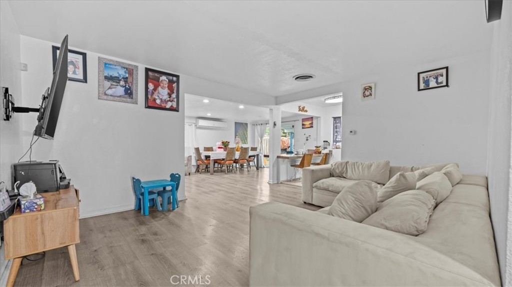 742 South Magnolia Avenue Rialto, CA 92376 - Photo 4 of 19 a living room with furniture and wooden floor