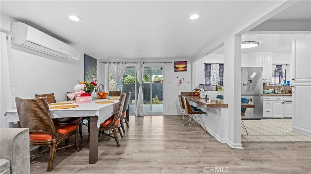 742 South Magnolia Avenue Rialto, CA 92376 - Photo 6 of 19 a view of a dining room with furniture and wooden floor