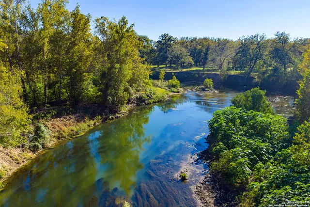 a view of swimming pool with a yard