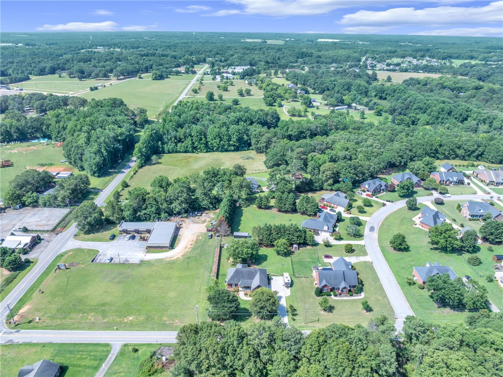 648 Mountain View Road Williamston, SC 29697 - Photo 42 of 42 Discover a community harmoniously nestled amidst verdant fields and mature trees, offering tranquil living.