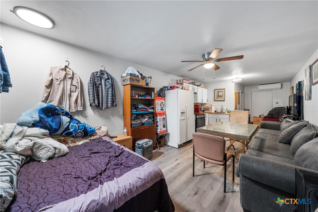 1211 South 17th Street Temple, TX 76504 - Photo 16 of 21 a living room with furniture and a bed