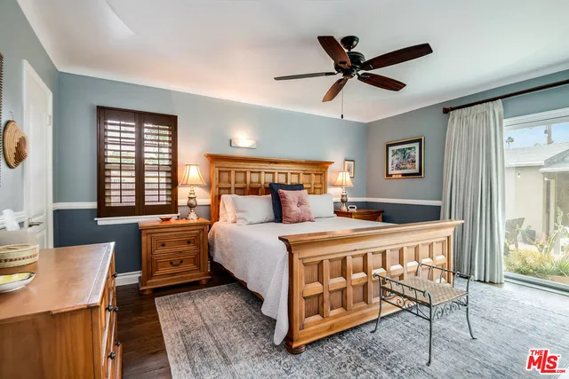 a bed room with a bed and a window