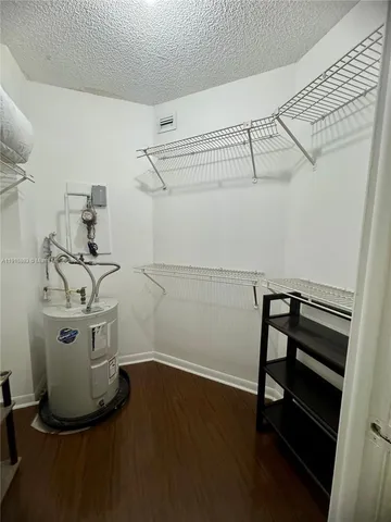 a view of a storage & utility room with racks on the wall