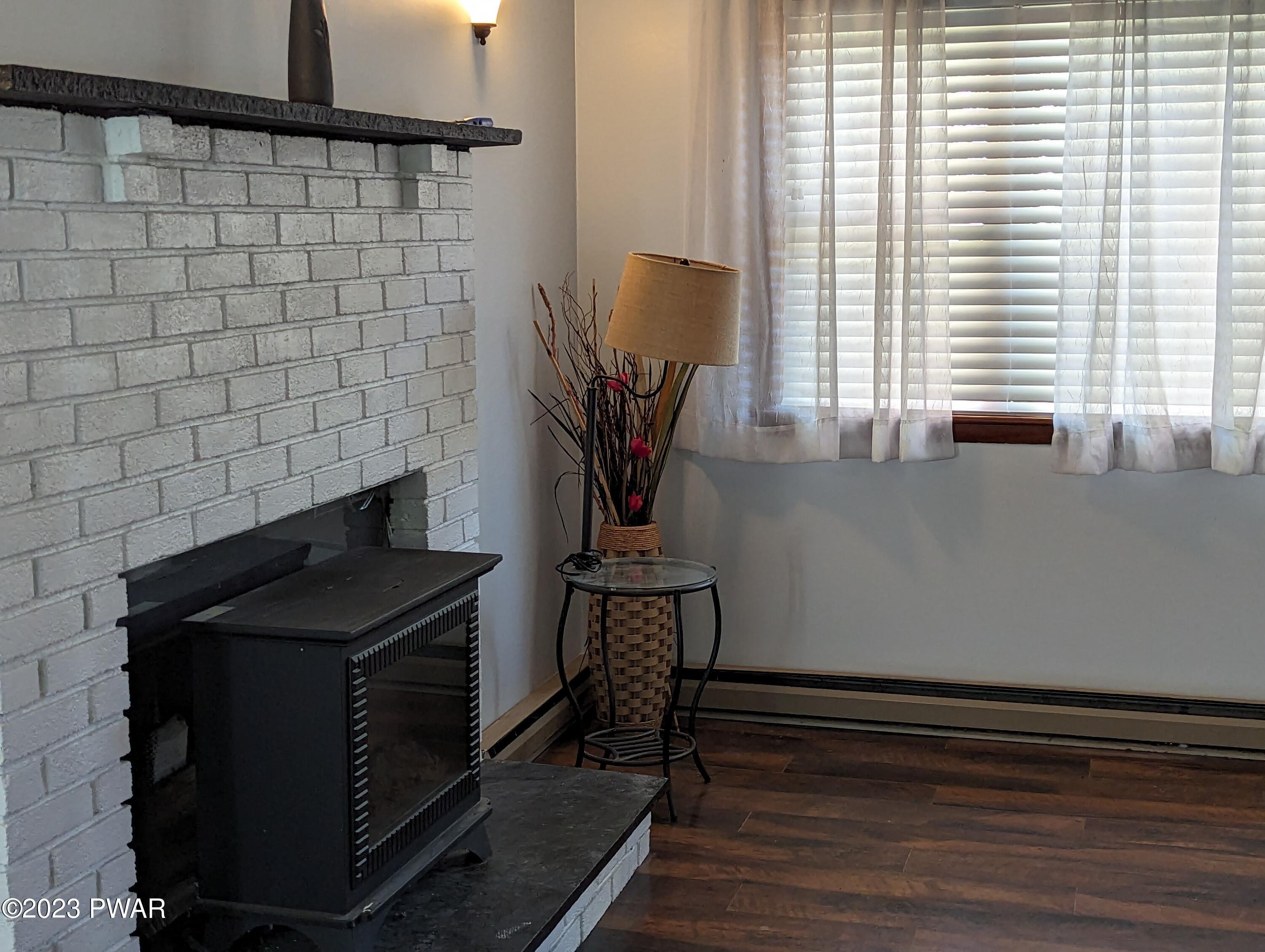 107 Pine Tree Road Shohola, PA 18458 - Photo 9 of 24 LR fireplace/ Electric insert or Wood