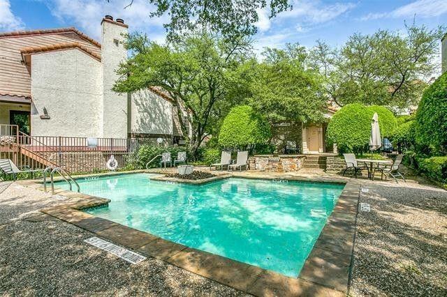 5626 Preston Oaks Road, Unit 39C Dallas, TX 75254 - Photo 14 of 38 Community pool featuring a patio and stairway