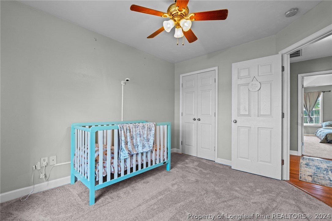 176 Clearbrook Place Raeford, NC 28376 - Photo 19 of 36 a view of a room with a chandelier fan