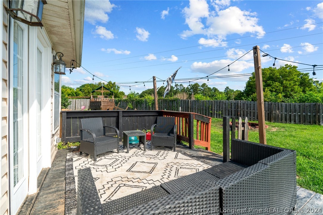 176 Clearbrook Place Raeford, NC 28376 - Photo 31 of 36 a view of a patio with a table and chairs