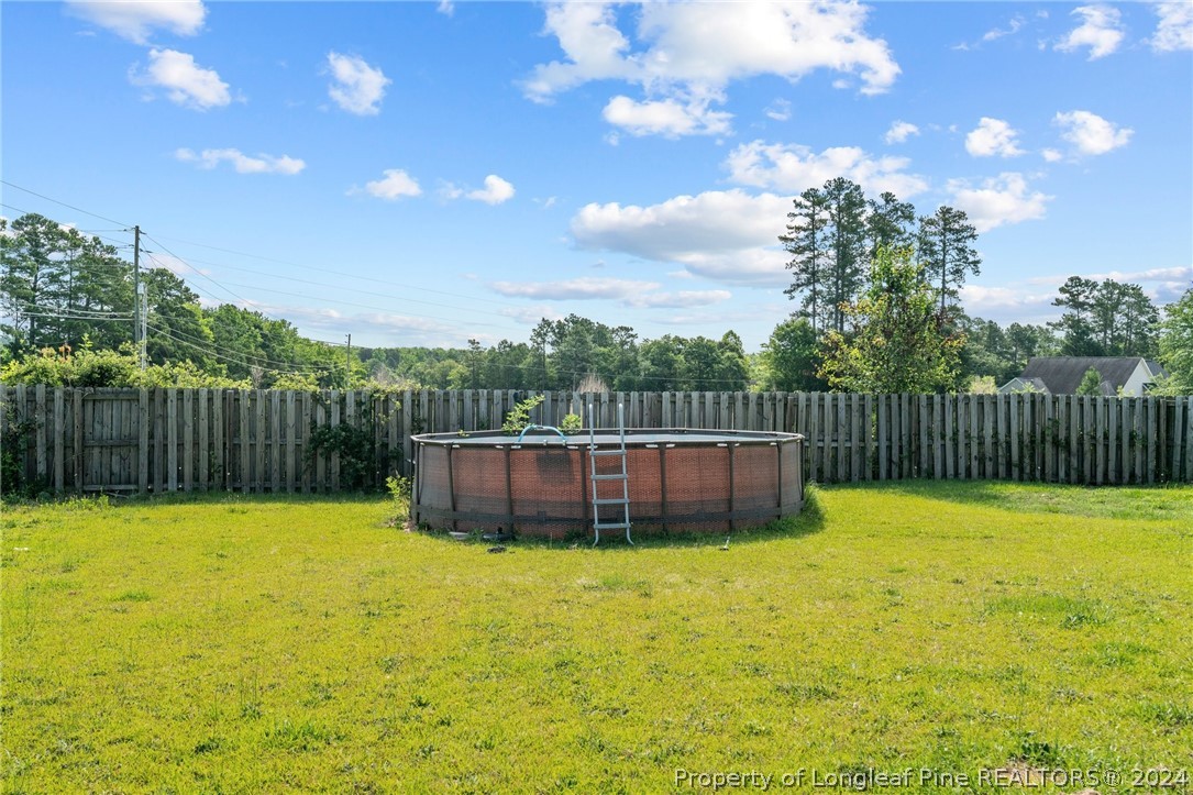 176 Clearbrook Place Raeford, NC 28376 - Photo 35 of 36 a view of a garden with wooden fence