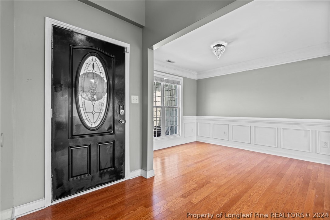176 Clearbrook Place Raeford, NC 28376 - Photo 4 of 36 a view of a livingroom with furniture and hardwood floor