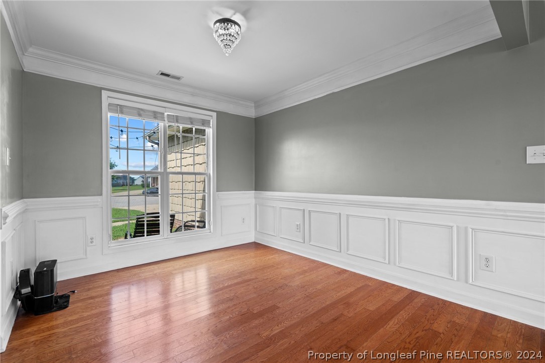 176 Clearbrook Place Raeford, NC 28376 - Photo 5 of 36 a view of an empty room with wooden floor and a window