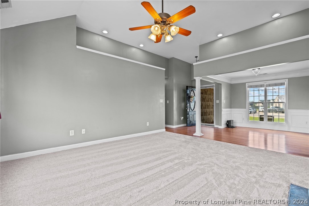 176 Clearbrook Place Raeford, NC 28376 - Photo 7 of 36 a view of an empty room with window and chandelier fan