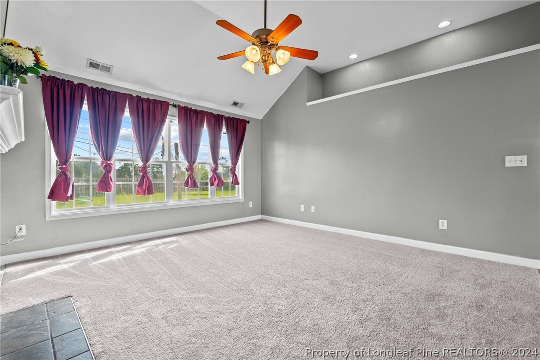 176 Clearbrook Place Raeford, NC 28376 - Photo 8 of 36 an empty room with windows and fan