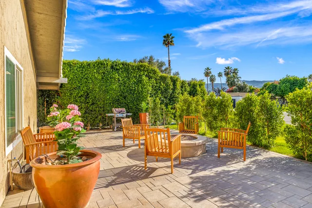 a living room with stainless steel appliances kitchen island granite countertop furniture and a kitchen view