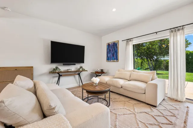 a view of a swimming pool with a patio
