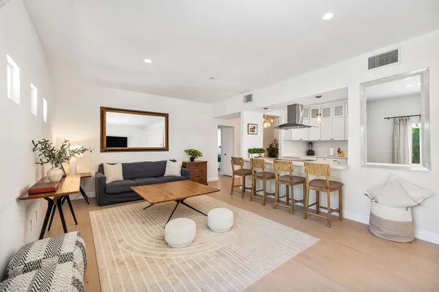 a kitchen with a sink a counter top space and a window