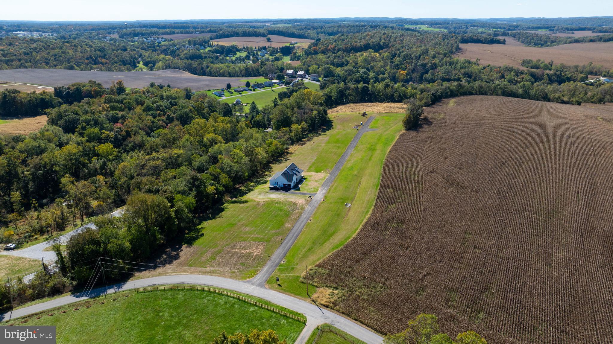 7 Harambe Overlook Railroad, PA 17355 - Photo 7 of 16 an aerial view of a house with a yard and lake view