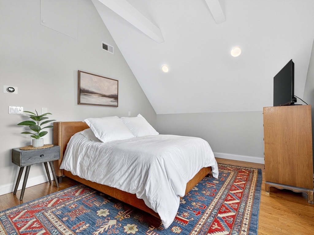 15 Crest Road Wayland, MA 01778 - Photo 12 of 36 a bedroom with bed and wooden floor