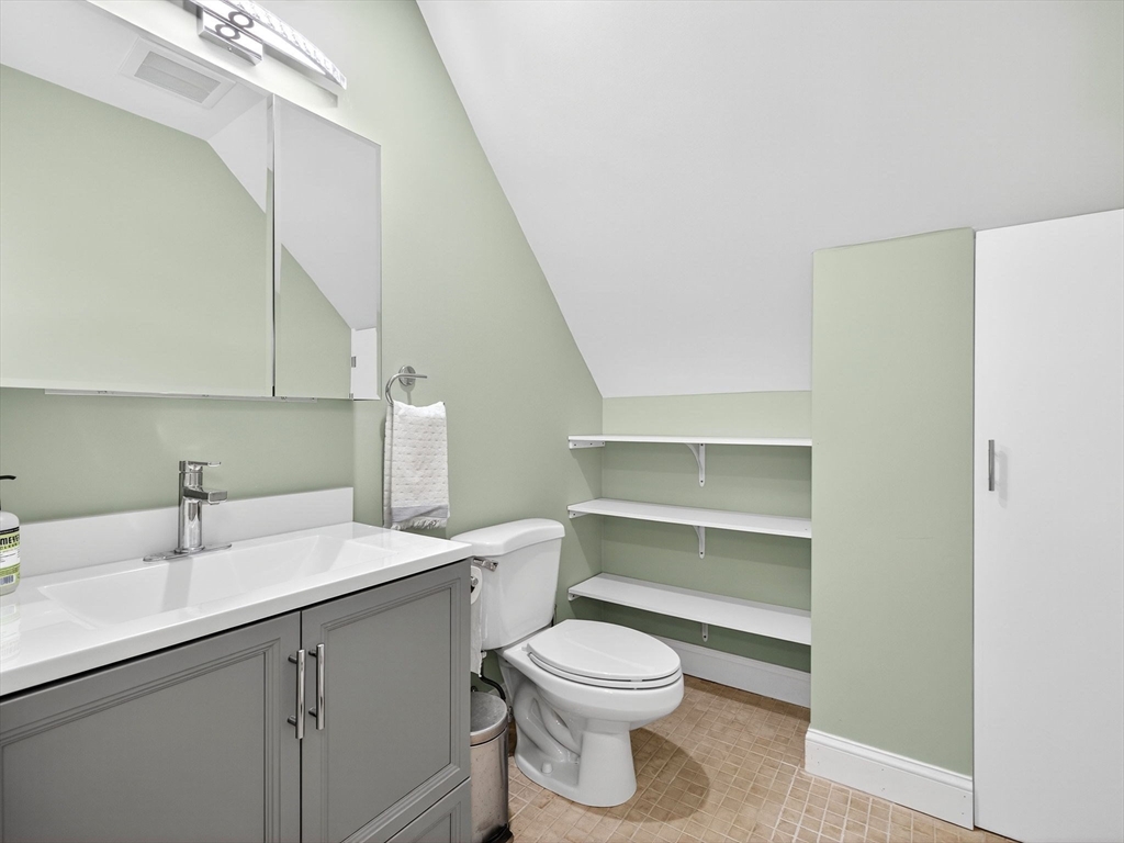 15 Crest Road Wayland, MA 01778 - Photo 16 of 36 a bathroom with a sink a toilet and vanity