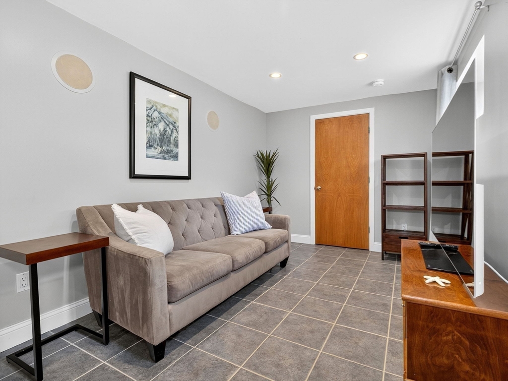 15 Crest Road Wayland, MA 01778 - Photo 20 of 36 a living room with furniture a walk in closet and a window