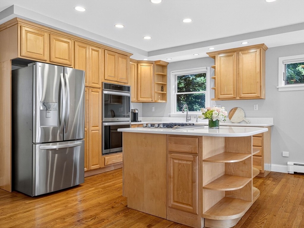 15 Crest Road Wayland, MA 01778 - Photo 8 of 36 a kitchen with granite countertop stainless steel appliances a sink and a window