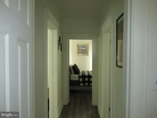 a view of a hallway and a livingroom