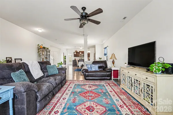 a living room with furniture and a flat screen tv