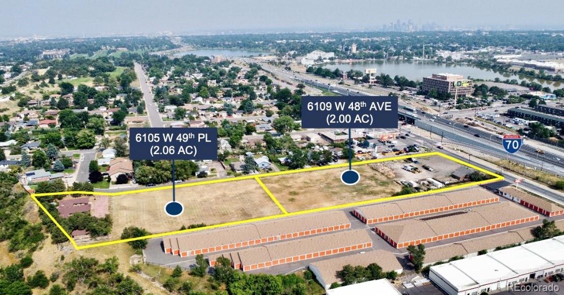 6105 West 49th Place Wheat Ridge, CO 80033 - Photo 2 of 2 an aerial view of a swimming pool and mountain view