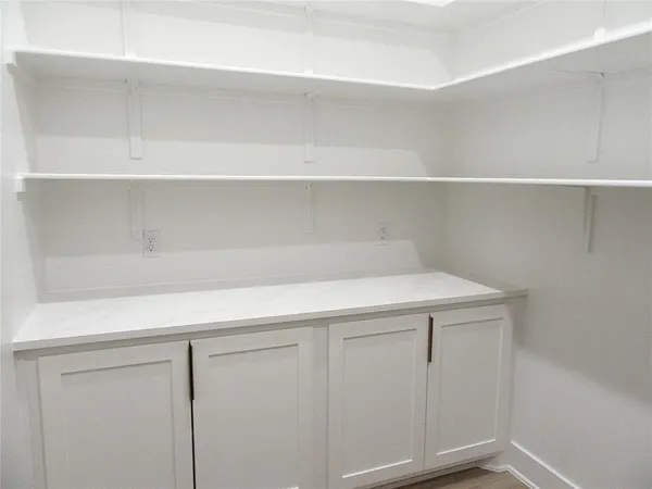 a kitchen with granite countertop a sink and a stove
