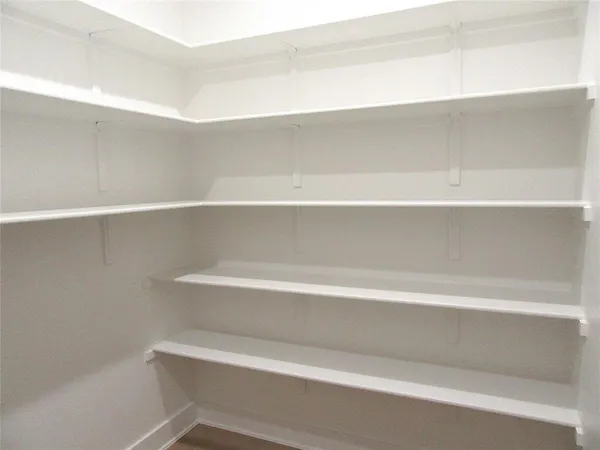 a bathroom with a sink toilet and mirror