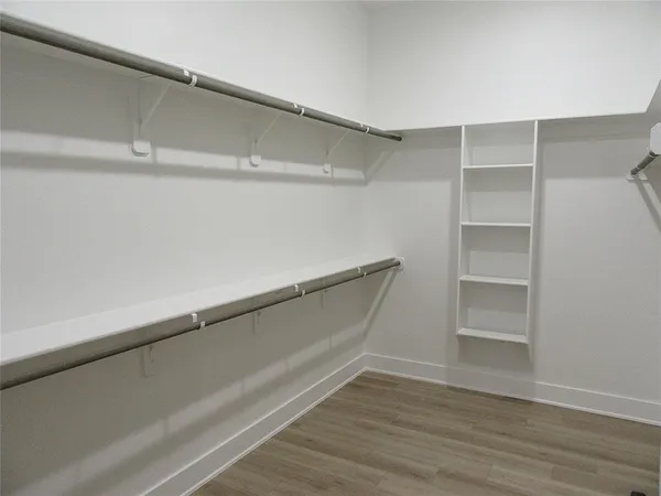 a living room with a fireplace and a floor to ceiling window