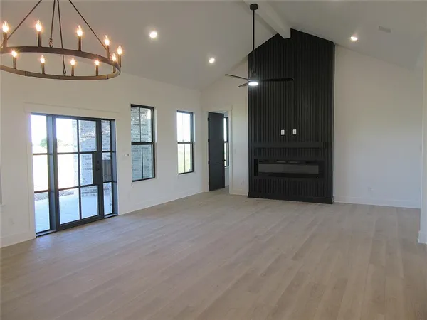 a large kitchen with stainless steel appliances kitchen island a large counter space a sink appliances and cabinets