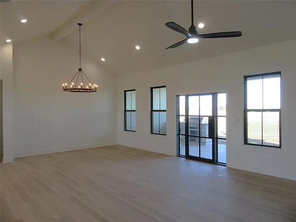 a kitchen with stainless steel appliances granite countertop a sink a stove and a refrigerator