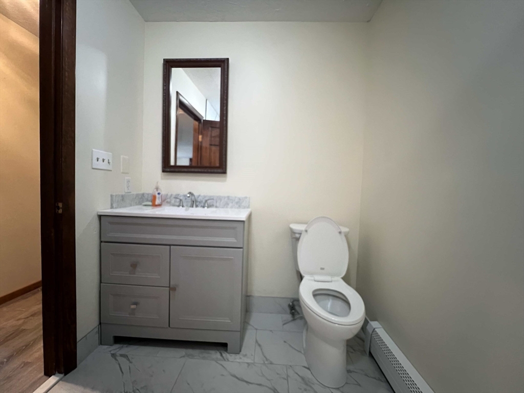 23 Hospital Road Templeton, MA 01436 - Photo 11 of 32 a bathroom with a toilet a sink and mirror