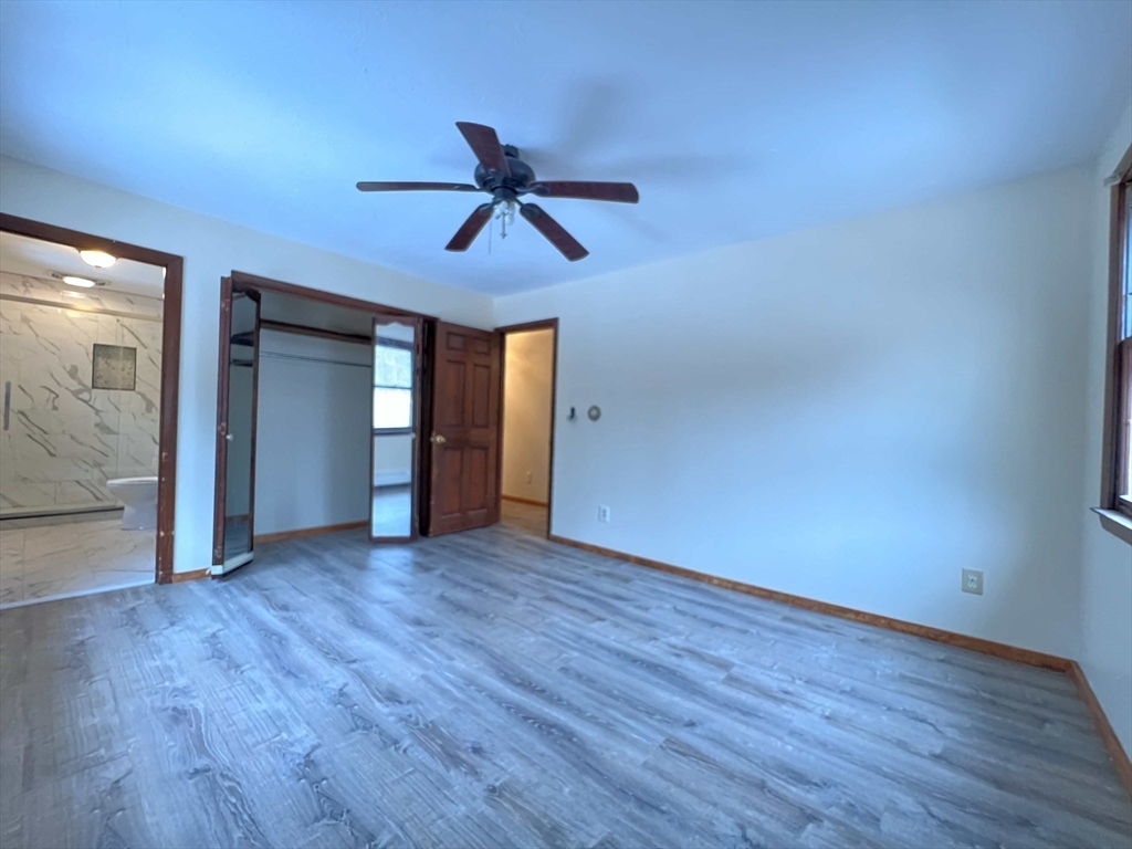 23 Hospital Road Templeton, MA 01436 - Photo 21 of 32 a view of empty room with wooden floor and ceiling fan