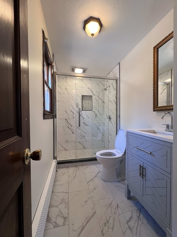 23 Hospital Road Templeton, MA 01436 - Photo 24 of 32 a bathroom with a toilet a sink and shower