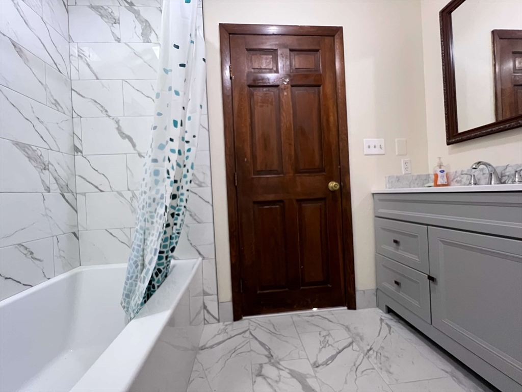 23 Hospital Road Templeton, MA 01436 - Photo 10 of 32 a bathroom with a bathtub and a sink