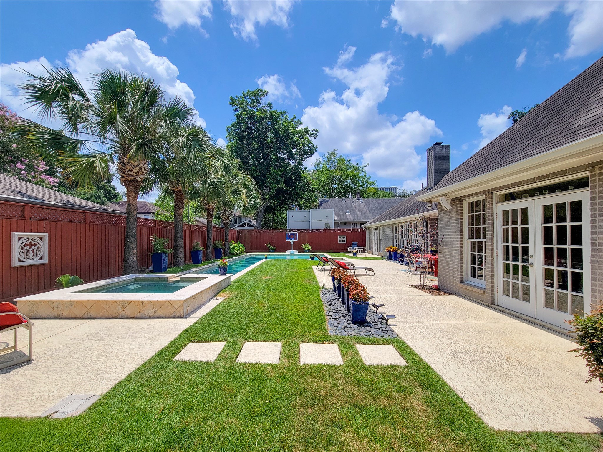 4401 Roseland Street Houston, TX 77006 - Photo 39 of 46 Hard to find 100 foot long, huge backyard with large patio areas, gigantic saline pool, spa, lap pool and plenty of green grass for kids and dogs!!