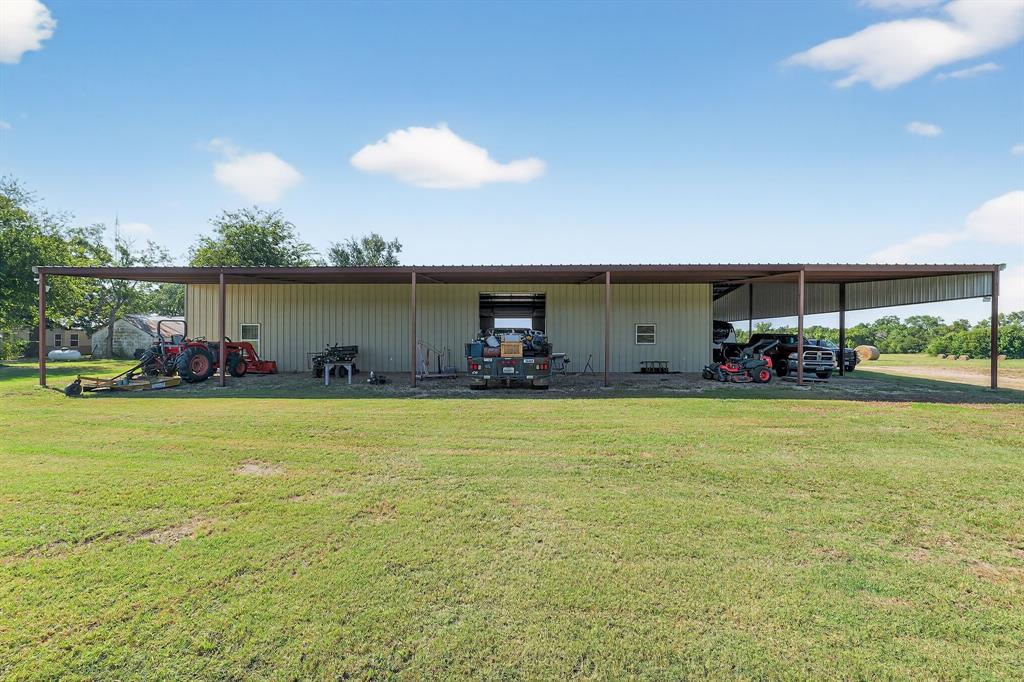 5485 Highway 7 Marlin, TX 76661 - Photo 11 of 36 View of pole building with a carport and a yard