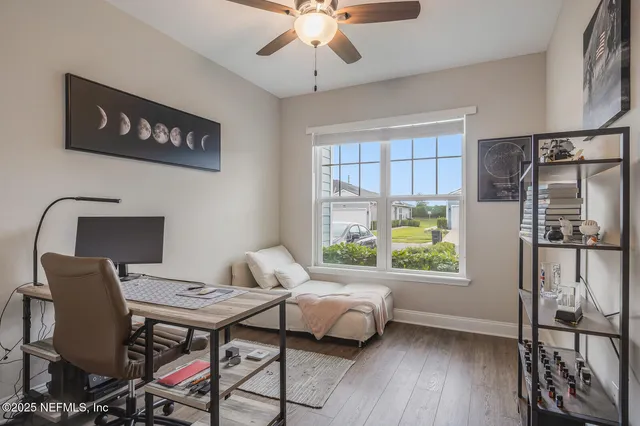 a reading room with furniture and a window