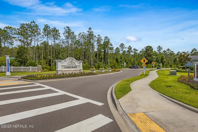 a view of a swimming pool with a house in the background
