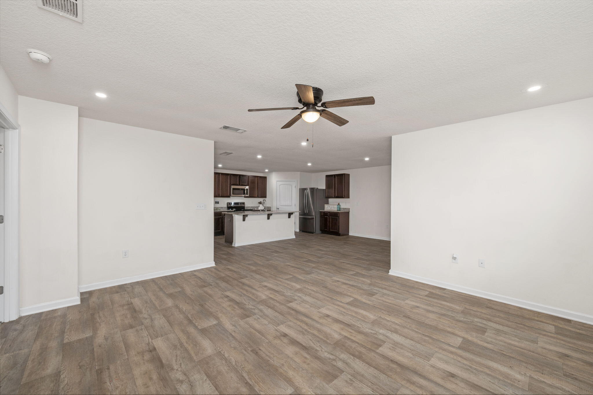 920 Merganser Way Crestview, FL 32539 - Photo 13 of 39 a view of a kitchen with a sink and a refrigerator