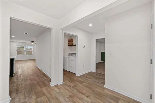 a bedroom with bed and a potted plant